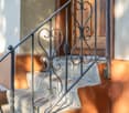 Stairs with wrought iron railing, 4 steps
