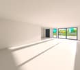 Large room with sliding glass doors to a balcony with a view of the garden and vegetation