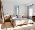 modern bedroom with wooden floor, bed, nightstands, mirror, desk, chair, curtains