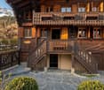 3 story wooden chalet, wooden balcony, wooden stairs, wooden fence, garden, mountain view