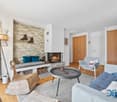 Living room: fireplace, bench, lamps, furniture, fireplace