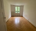 empty room, wooden parquet floor, white walls, windows, doors