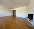 Fireplace, white walls, wooden floor, empty room