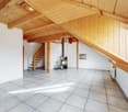 empty attic room, tiled floor, wooden ceiling, fireplace