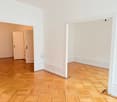 empty room, parquet floor, white walls, two doors