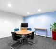 round table, 6 chairs, TV, wooden desk, potted plant