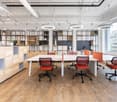 modern design, white walls, wooden floors, large windows, meeting area, office chairs