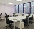 modern office, white tables, black chairs, large windows, plants
