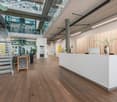 modern design with wooden floors, white walls, glass railings, modern furniture