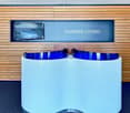 modern style business lounge with white desk, wooden wall, monitor
