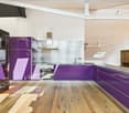 Open plan kitchen, with purple cabinets, granite countertops, stainless steel appliances, wooden floor, and white walls.