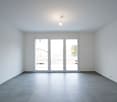 empty room, sliding glass doors, gray tiles, white walls, no furniture