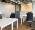 modern office, white walls, wooden floor, white desks, black chairs, lamp, glass partition, door