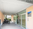 Corridor with glass walls and door, parking place, ceiling design
