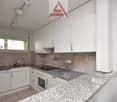 white cabinets, granite countertops, white appliances, tiled floor, power outlet, window with view