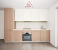 modern kitchen, white cabinets, wooden countertops, stainless steel appliances, modern sink and faucet