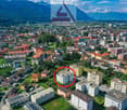 City center building, residential building, multiple floors, green areas