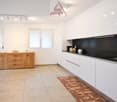 kitchen area with white walls, wooden cupboard, stainless steel sink, dishwasher