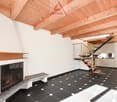 fireplace with mantle, modern design, large modern staircase, white walls, black floor