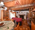 wooden ceiling, fireplace, dining table, wooden chair, cupboard