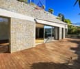 modern house, brick wall, wooden deck, glass doors, glass windows