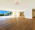 large open space, hardwood floors, sliding glass doors, large windows, view of mountains