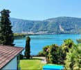 lakefront view, mountain range, trees, buildings