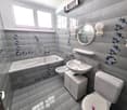 Bathroom with bathtub, toilet, sink, bidet, and decorative tiles