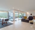 Modern design, dining table, glass door, large windows, balcony, modern furniture