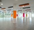 empty room, tiled floor, glass windows, color pillars