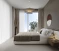 King size bed, large window with balcony, nightstand with lamp, beige blanket, two nightstands with lamps, vase, curtains