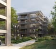 A multi-story residential building with balconies, surrounded by a garden with walking paths and seating areas.