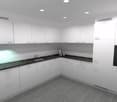 modern design, white cabinets, black granite countertop, black integrated oven, stainless steel sink