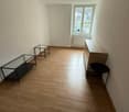 empty room, wooden floor, white walls, glass tables, window, radiator