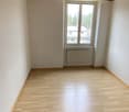 empty room, wooden floor, white walls, wooden ceiling, window, radiator
