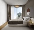 large bed, gray bedding, pillows, nightstand, large window, curtains, floor lamp, round mirror, artwork, vase with flowers