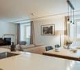 open kitchen and living room, couch, tv, dining table, window, dining chairs