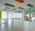 empty room, large glass windows, tiled floor, large building view, white ceiling