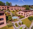 Collection of buildings with swimming pool and landscaped garden