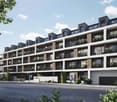 Multi-story apartment building with balconies, modern architectural design, and greenery surrounding the building.