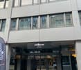 The image shows a multi-story commercial building with a large glass facade. The building has the 'Citypop 2night' logo displayed prominently on the front entrance. The building appears to be a modern, commercial structure with a sleek, minimalist design.
