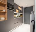Modern kitchen with gray cabinets, built-in appliances including a dishwasher, open shelving, and a marble-like countertop. The kitchen has a clean, minimalist design with a mix of wood and gray tones.