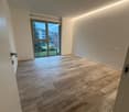 wooden flooring, large windows with balcony, modern interior design