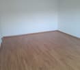 empty room, wooden floor, white walls, open doorway