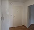 empty room, wooden floor, white walls, wardrobe, two open doors