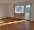 empty room, large window, sliding door, tiled floor, balcony, radiator