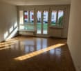 large windows, wooden parquet floor, empty room