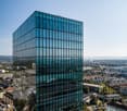 modern office building with glass facade and multiple floors