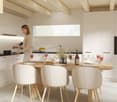 white modern kitchen, wooden countertop, modern cabinets, white chairs, wooden table