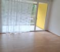 sliding doors, balcony, hardwood floors, large windows